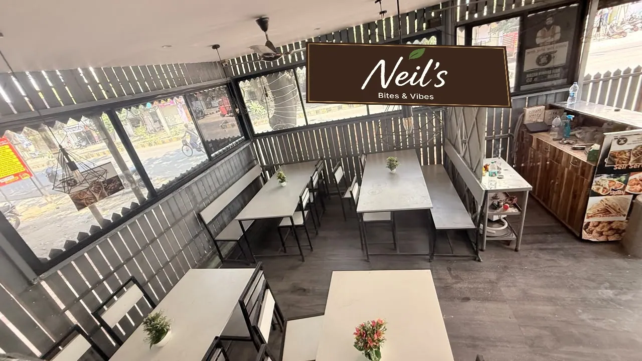 Actual restaurant interior with Neil's brand preview